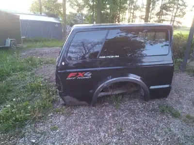 08 Ford F250 super duty short box (6'9"), topper, tailgate and tail lights, along with a bedslide. D...