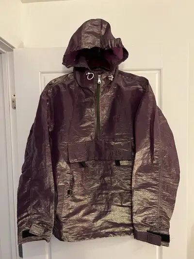 Men’s medium Urban Outfitters men’s iridescent reflective windbreaker in excellent condition has a s...