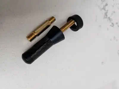 Shorty carbon fiber look antenna with different adapter brass threaded stems .