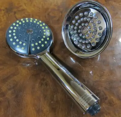 Shower head plus handheld shower with hose. Come exactly as pictured, see 8 pics. One is like new, a...