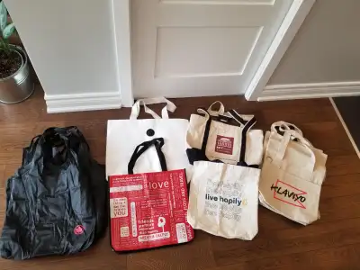 21 reusable bags in excellent condition - 2 Lululemon - 5 Air Canada. New/Never used - 2 Zoho - 2 Ca...