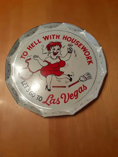 This metal tray is a retro piece featuring a humorous design, perfect for adding a bit of vintage Ve...