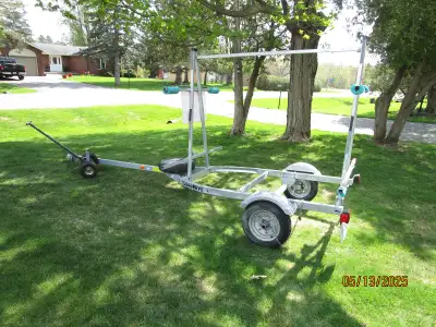 Load Rite 4 Kayak /Canoe Galvanized Trailer. Comes with Spare tire and Moving Dolly .Hubs have greas...