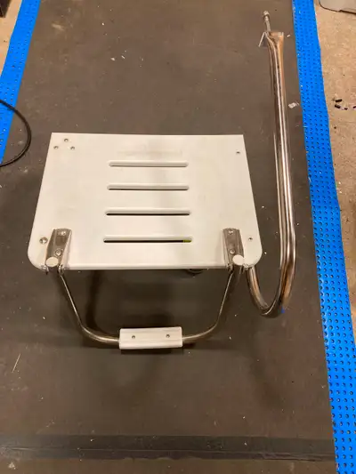 Used swim platform with one step, bolts onto the transom of your boat.