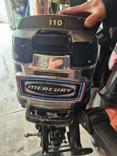 This is a used Mercury 9.8 hp outboard motor with tank and hose. Sat in garage for 25 years then new...