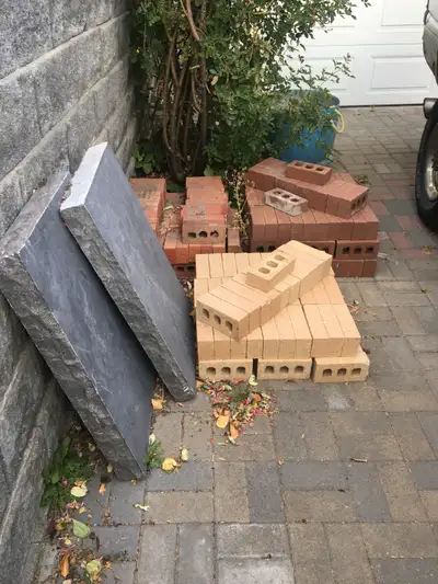 New clay bricks, stone slabs, various masonry gear, View more