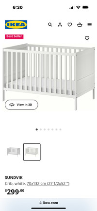 IKEA white crib with a mattress