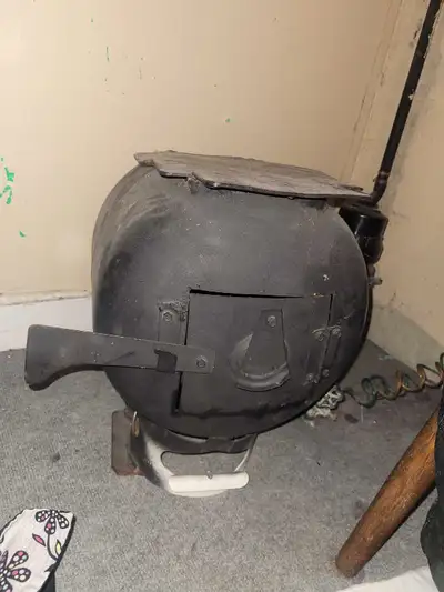 Made out of a propane tank. Good for camping, ice fishing, shack