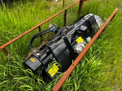 Heavy-duty flail mowers for skid steers are designed for tough vegetation and can handle various lan...