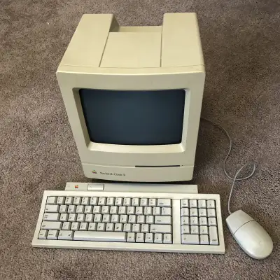 Vintage Macintosh Classic II with its original carrying case, View more