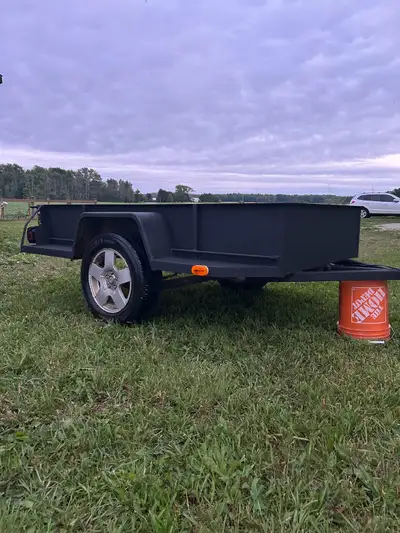 Nice heavy duty trailer. Used to haul firewood on my farm. Has a spare tire and loading ramps (1” pl...
