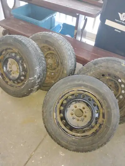 Gently used 15-in snow tires and rims 205 65 R15 is the size