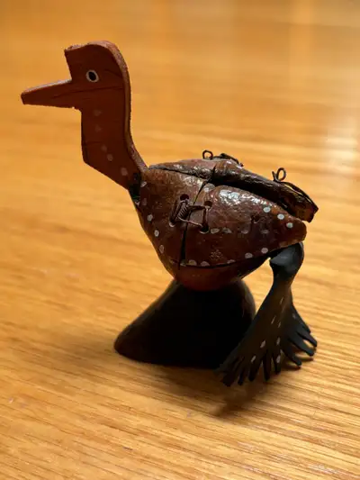 This whimsical vintage folk art sculpture features a charming bird made from natural materials. Poss...