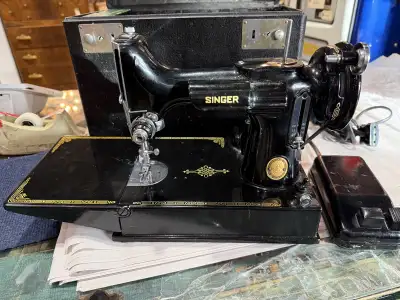 Singer featherweight sewing machine with case. Has a bit of wear. Working order $675 plus GST Locate...