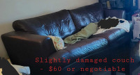 Slightly damaged couch for sale 