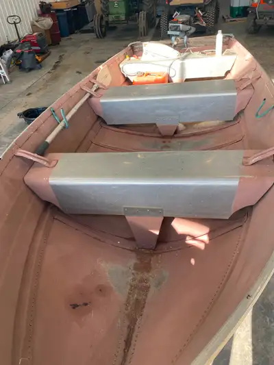 Older Smokercraft 12’ fishing boat with 9.9HP Evinrude 2stroke engine With life jackets, fuel tank a...