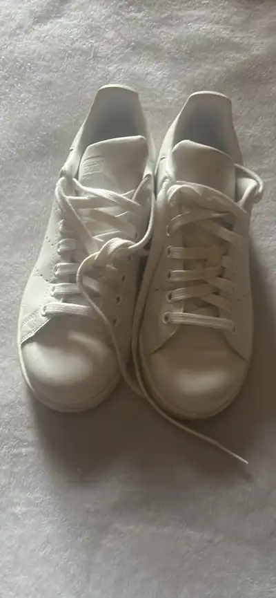 Classic Adidas Stan Smith sneakers. White color with white laces. US size 6.5. Worn 3-4 times, good...