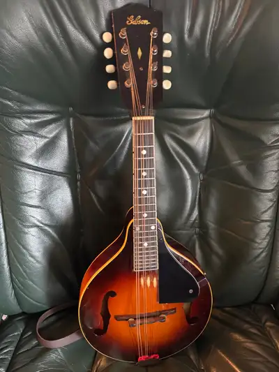 Early 1940’s Gibson mandolin w/ hardshell case. (Possibly 1942 ?, no way to confirm.) Plays easily,...