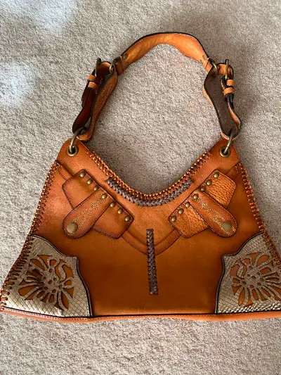 Excellent condition, bought at Holt Renfrew.