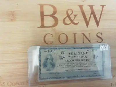 Suriname 1 Zilverbon Banknote $125 The Suriname 1 Gulden Silver Voucher is a fascinating piece of hi...