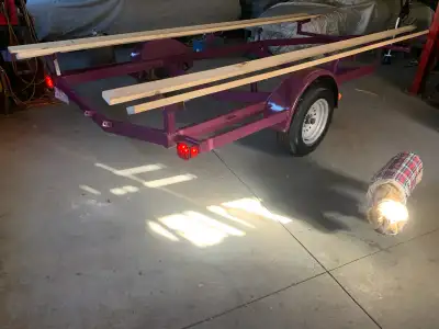 Holds up to 22' boat with pontoon width 6' center to center. 15" wheels, tires almost new, buddy bea...