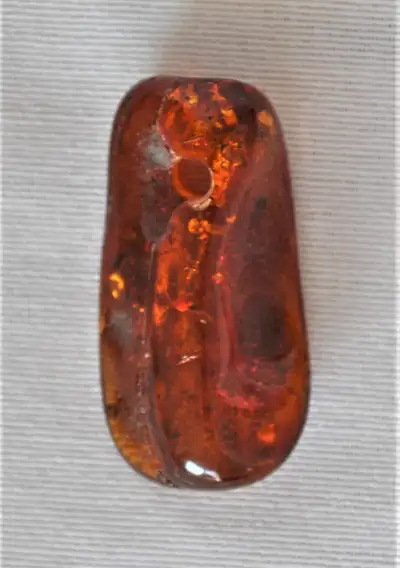 GENUINE BALTIC AMBER PENDANT - 3.5 cm long - Nice dark rich colour - Inclusions - Hole for chain at...
