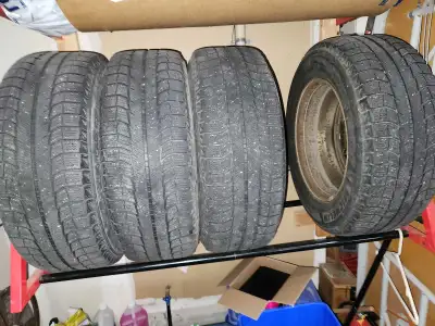 Tires are worn with low tread 245 65R17. Rims are still usable. $50 or best offer.