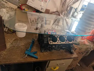 Have this Chev V-6 Engine block coffee table for sale, comes with glass , pick up only just outside...