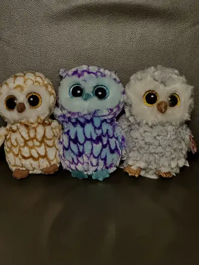 I have a set of 3 NEW with tags Ty beanie boo owls. They are brand new. Perfect for the collector. N...
