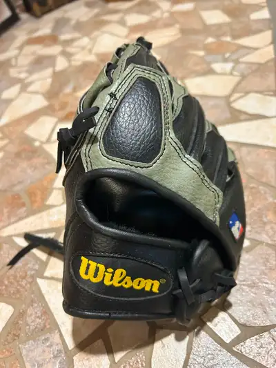 Wilson 10-Inch baseball glove (goes on right hand). Pickup South River Heights.