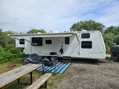 2008 28 foot Spree trailer made by KZ Slide out is 56 inches King Mattress base is 75 x 76 Hitch to...