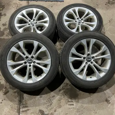 Set of four aftermarket aluminum alloy rims with 235/55R19 Continental CrossContact LX Sport all sea...