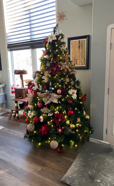 8ft Xmas tree with storage cases, without the ornaments and decorations. $50 OBO