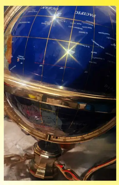 This exquisite Kalifano lapis lazuli globe features a stunning blue semi-precious stone surface acce...