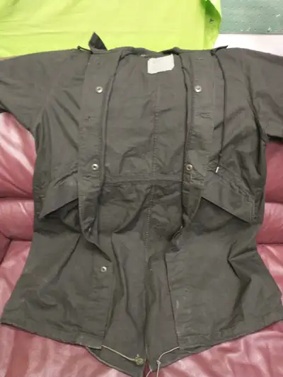 Black cotton long fishtail military hooded parka in near new condition. Size is medium but it fits o...