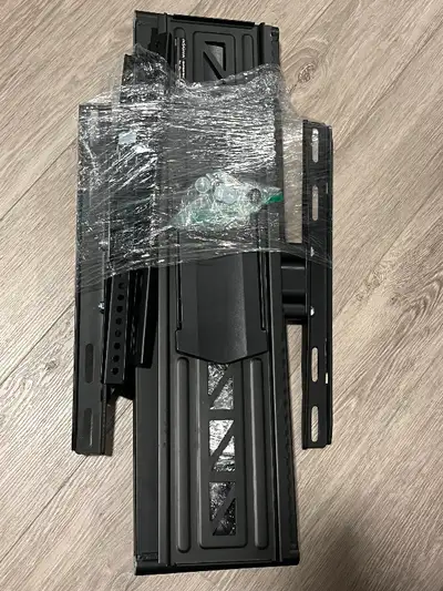Insignia TV wall bracket with all screws and attachments, in like new condition.