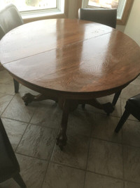 Antique solid oak claw foot round table
