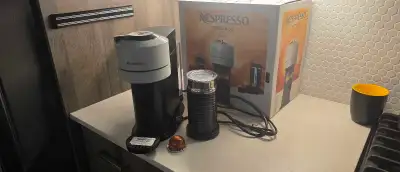 Hardly used Nespresso Vertuo Next coffee machine , beautiful White color . Fully functional and desc...