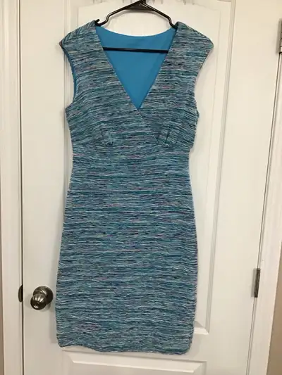 This is a blue Calvin Klein dress. It is a size 6. The dress is in good condition. * Size: 6 * Brand...
