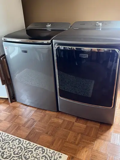 6 years old. Still on 10 year Warranty. Both in excellent Condition. Dryer is natural Gas.