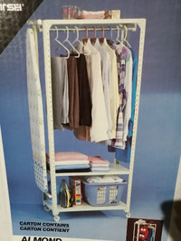 Metal clothing storage rack with shelves