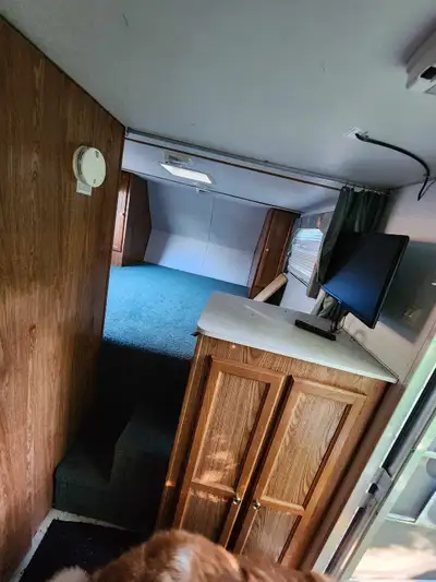 This fifth wheel camper trailer is a cozy home on wheels, ready for your next adventure! It's in use...