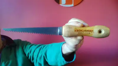 Benchmark1062-218. Wooden handle. 11" long overall. Blade 6". $4.00 buys it.