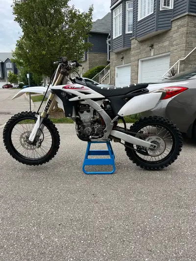 2011 Yamaha YZ 250F with a foldable trailer, helmet, goggles, boots and gloves. A whole riding packa...