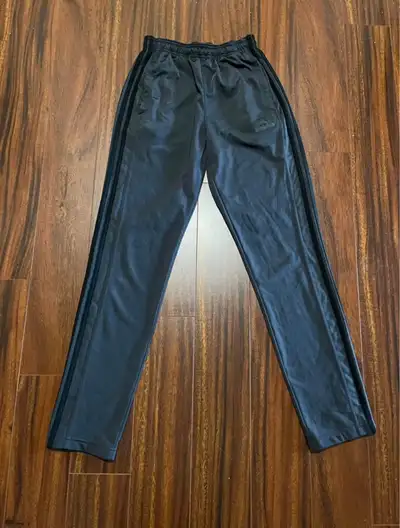 Great condition. Grey with black stripes down the side. Slim fit. Elastic waist with drawcord. Zippe...
