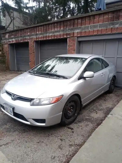Runs and drives great. Comes with 2 sets of wheels. 250,000 kms 2 door coupe. Call Bill at 1-437-262...