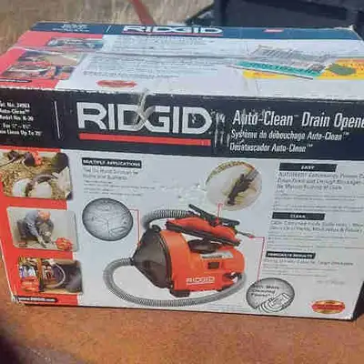 NEW in Box. This RIDGID K-30 Auto-Clean drain cleaning machine is designed to clear clogged tub, sho...