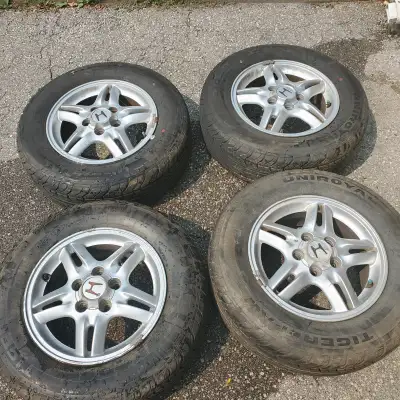 4 x OEM Honda Rims Bolt Pattern: 5 x 114.3cm; 6.5cm hole 4 x Uniroyal TigerPaw tires - DOT 2015 with...