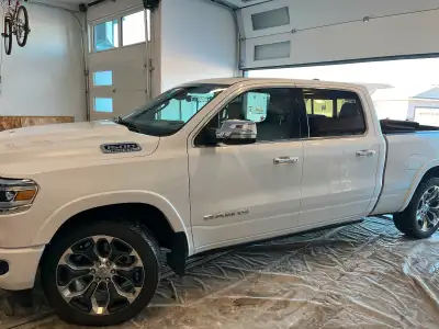 2020 Ram Longhorn in very nice condition. Good rubber. Tonneau cover. Brand new windshield. Box line...