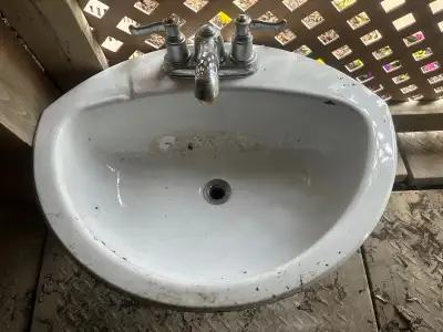 Sink with faucet and drain, View more
